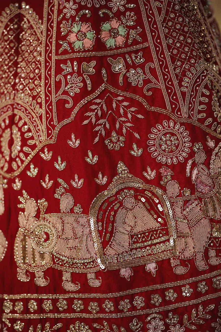 Close-up of red and gold bridal embroidery
