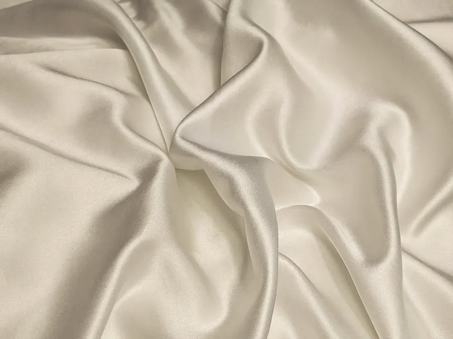 Unstitched ivory fabric in soft folds